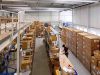 Tantzky Werkshalle, viele Kartons, Regale, Ausschnitt des Hochregals